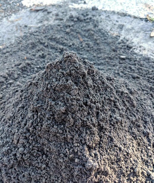Bottom ash, a heap of the coarse dark grey fraction from the boiler furnace